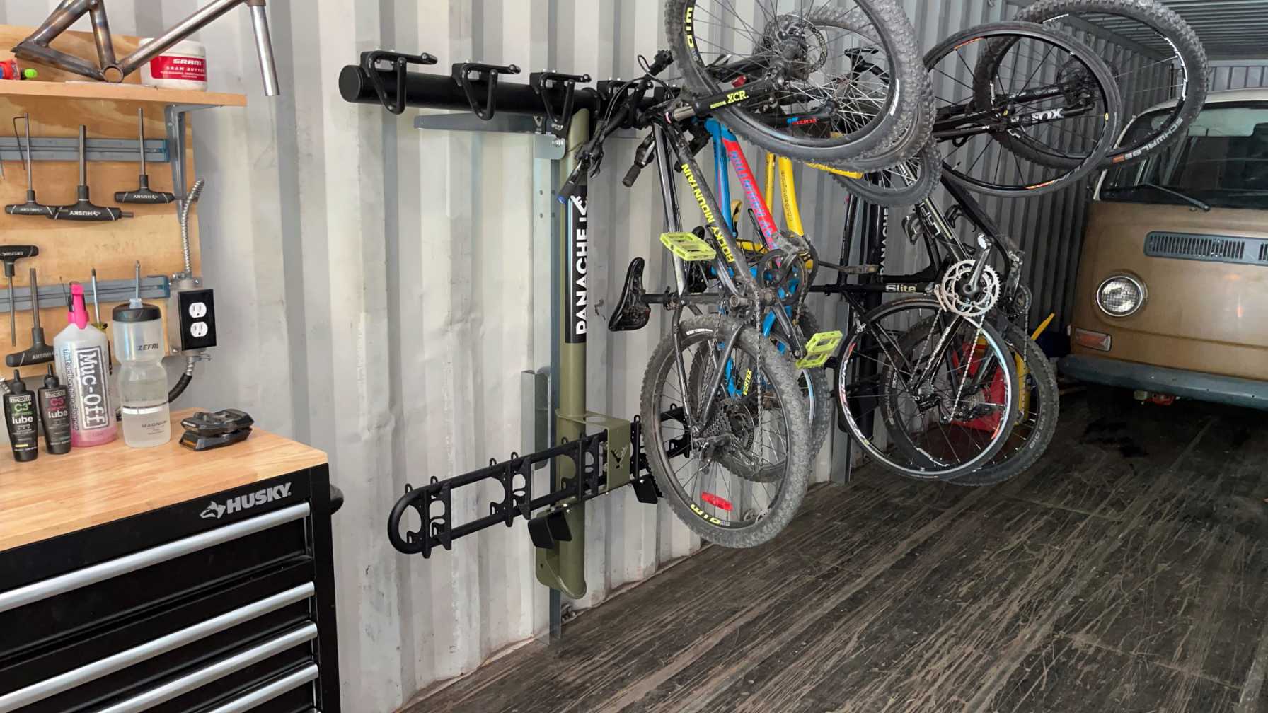 Panache Rack Wall Mount for T2, T4 and T6 vertical bike racks installed in storage area with bikes suspended on rack.